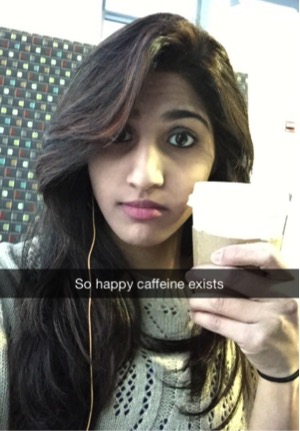 Senior Asma Vohra shows off her love for coffee prior to learning about that two cups of coffee per day may reduce the risk of cirrhosis. Photo courtesy of Asma Vohra.