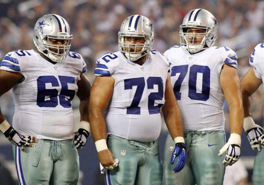 28 SEPTEMBER 2014: Dallas Cowboys guard Ronald Leary (65) and center Travis Frederick (72) and guard Zack Martin (70) during a regular season NFL football game between the Dallas Cowboys and the New Orleans Saints at AT&T Stadium in Arlington, TX.