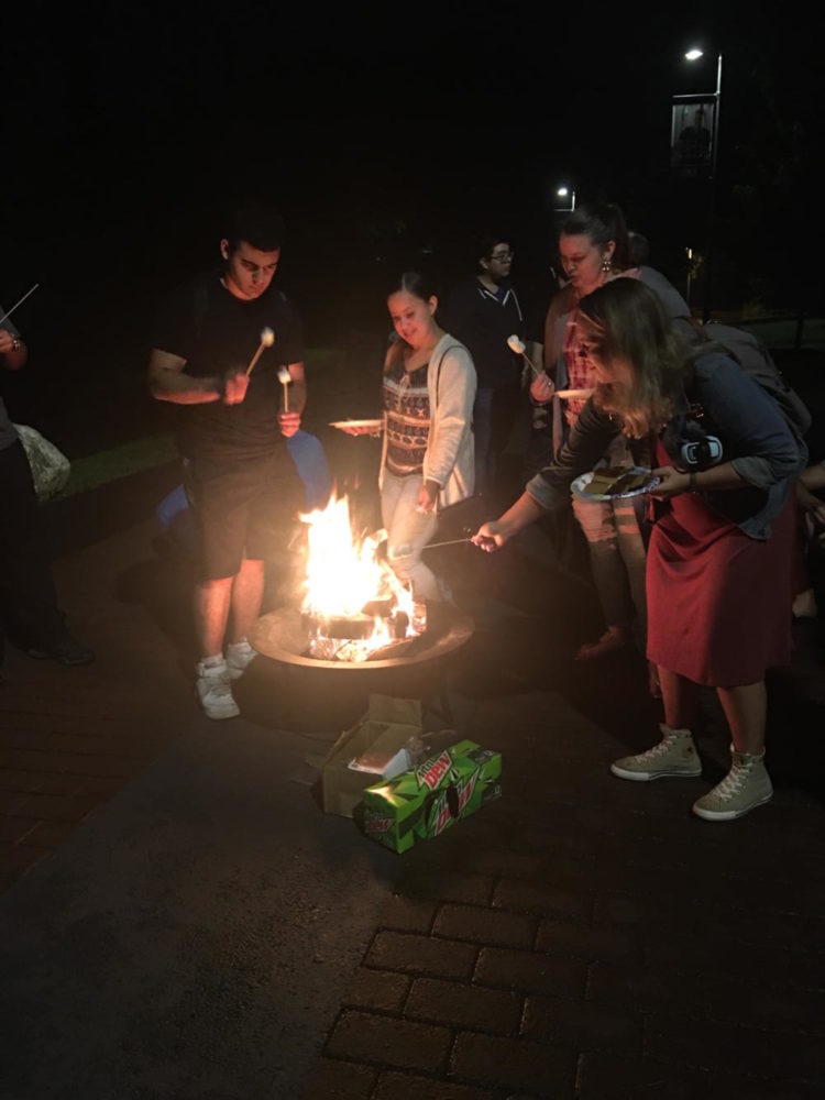Students preparing to roast their marshmallows and make Smores