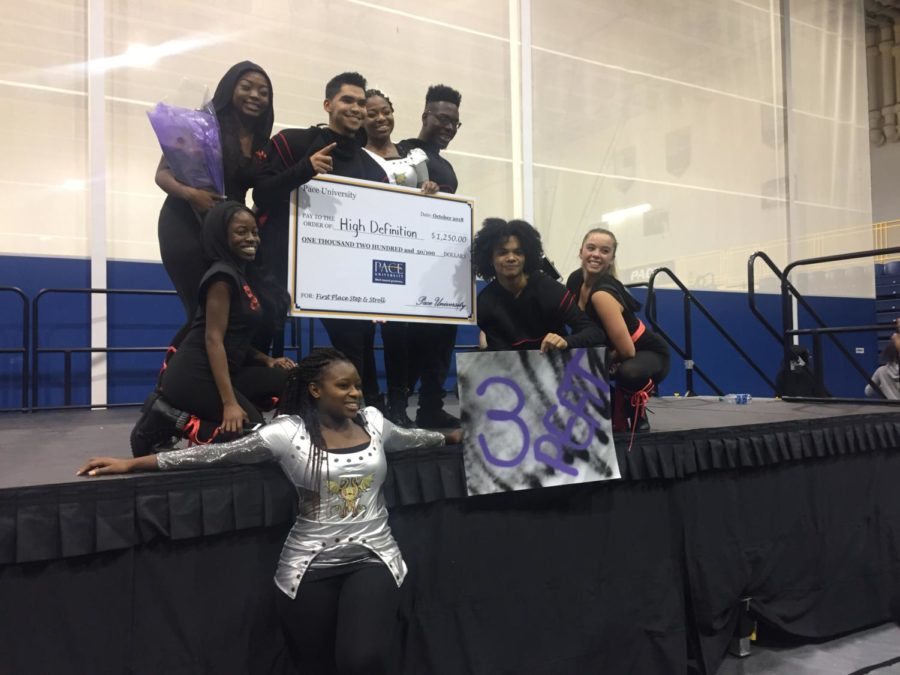 High Definition poses on the stage with their $1,250 prize after winning the Step and Stroll Competition 