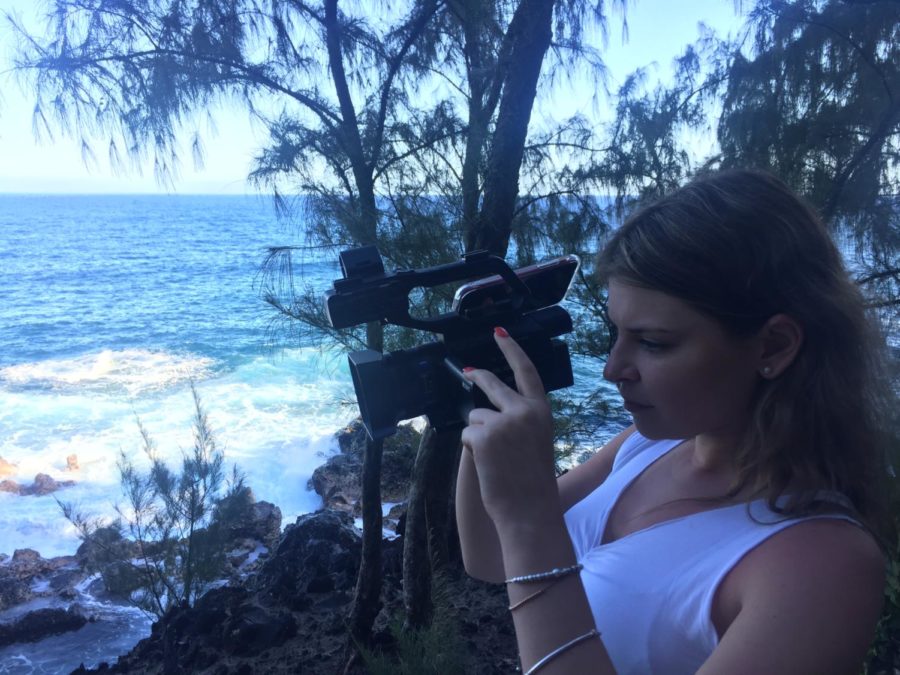 Talenti is pictured capturing footage of a black sand beach in Hawaii during production over Spring Break. 