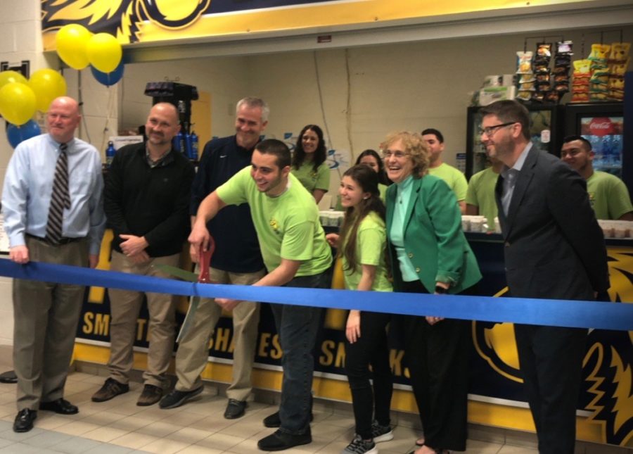 Matthew+Lasala+cuts+the+ribbon+to+mark+the+official+grand+opening+of+PaceFit.+Lasell+was+surrounded+by++Nicole+Forgione%2C+his+team+of+managers%2C+Kathy+Winsted+and+the+athletics+department.