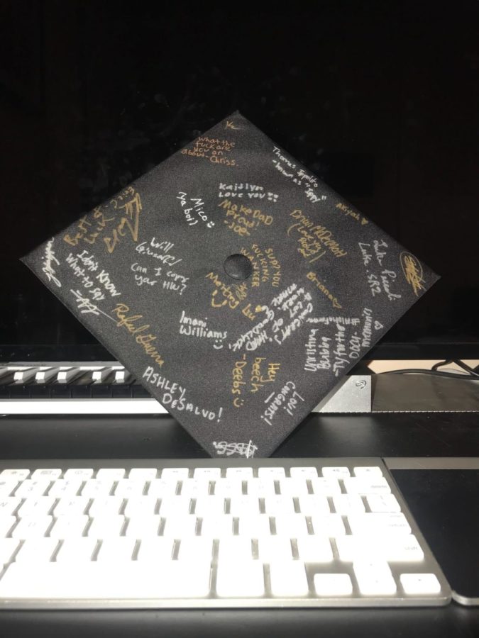 Seniors have the option of decorating their graduation cap for their big day. Many students, such as Jason Zhizpon, choose to get it signed by their friends to commemorate their final year at Pace. 
