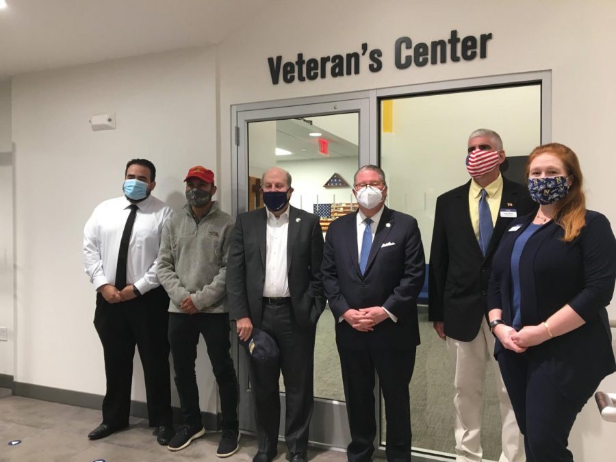 (From left to right)
Garcia, Singh, Krislov, Harkham, Riley, and Carpenter posing outside Paces newly unveiled Student Veterans Center. The center will provide student veterans and military dependents with a place to socialize and access specialized resources.