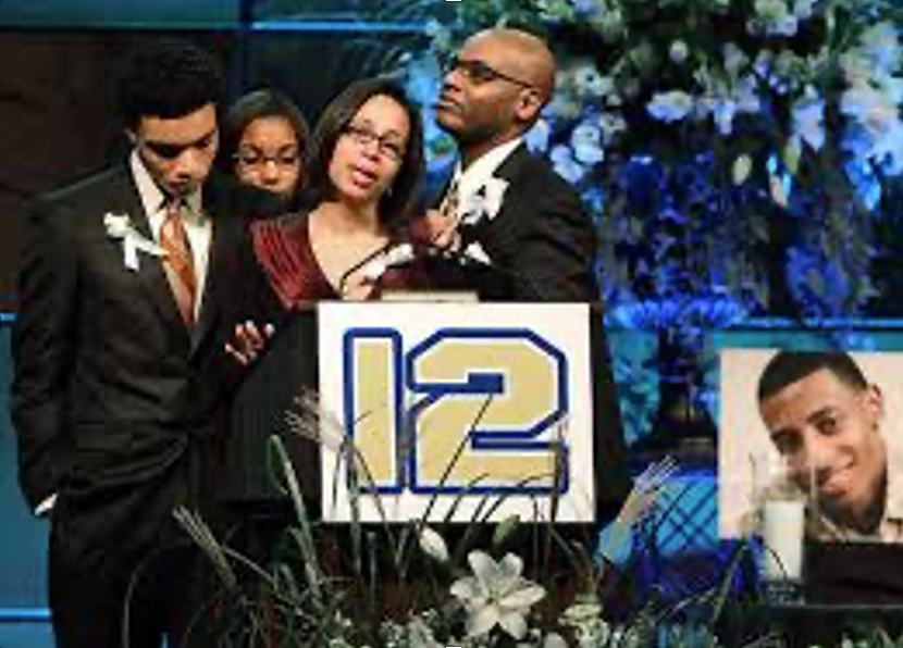 Henry’s family honors him at his memorial service. #12 was his football  number and now will be retired from use in his honor. 