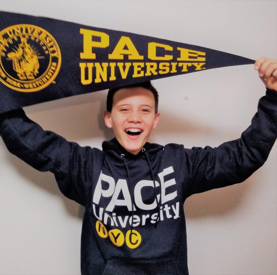 Shahab Gharib poses with Pace University merchandise after acceptance. 