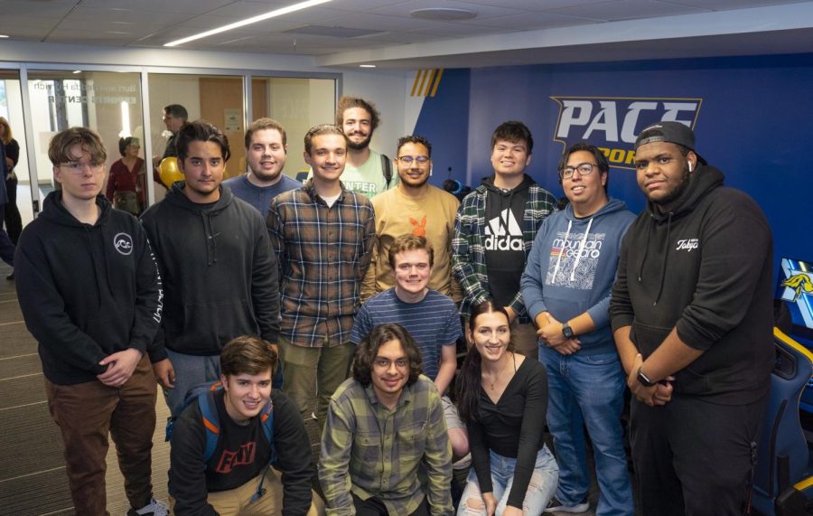 Members of The Pace Esports Team Pose In front Their New Arena