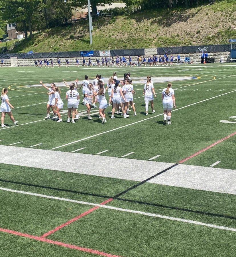 The Womens Lacrosse team salutes the home crowd