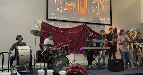 Pep Band performs at Programming Boards Holiday Open Mic Night in Fall 2022 (Kat Brennan)