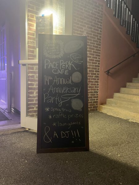 Pace Perk Cafes Chalkboard Advertisement of Their 14th Anniversary Party outside its doors on April 15, 2024