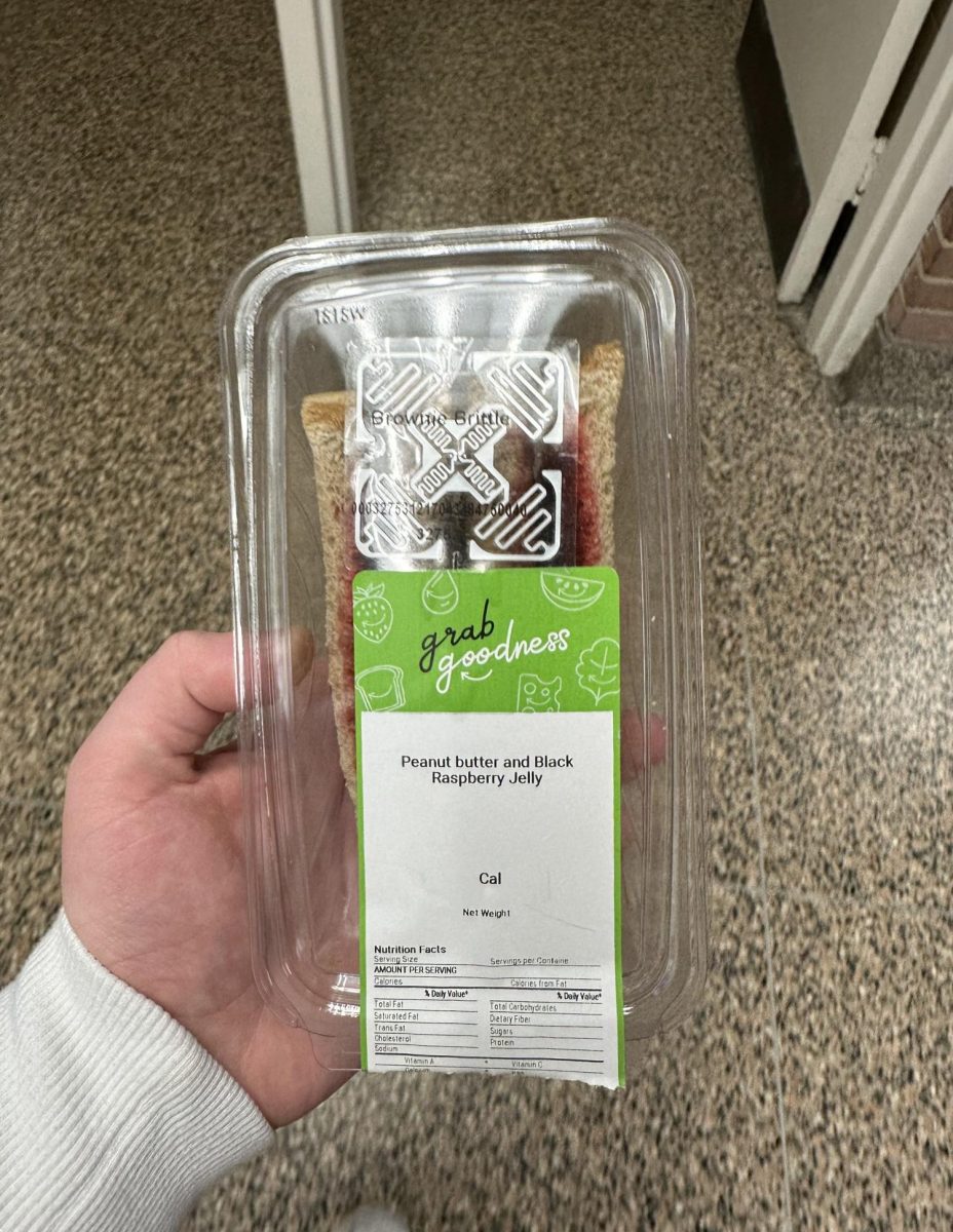 A peanut butter and jelly sandwich (label below) is incorrectly tagged as brownie brittle(top of product) in Miller Mart.
